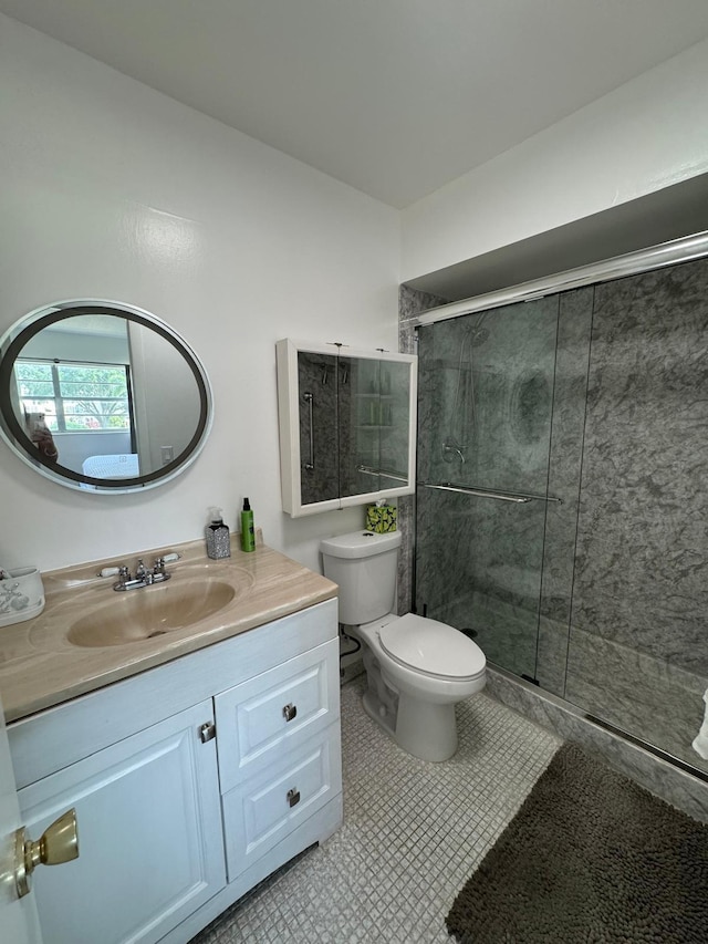 4441 NW 16th St Unit J210, Lauderhill, FL 33313 - bathroom featuring vanity, a shower stall, toilet, and tile patterned flooring