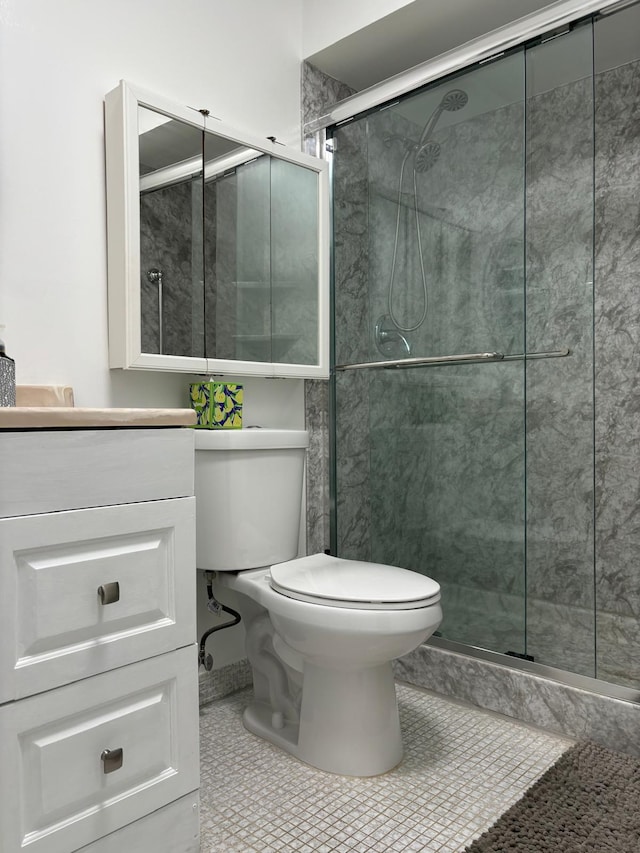 4441 NW 16th St Unit J210, Lauderhill, FL 33313 - bathroom with toilet, a shower stall, vanity, and tile patterned floors