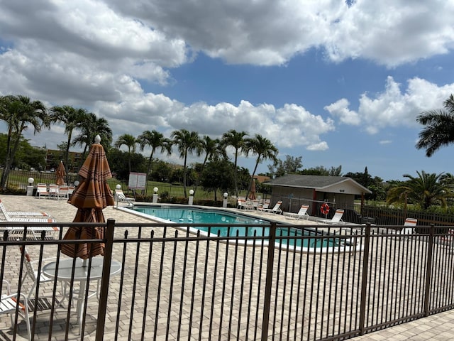 4441 NW 16th St Unit J210, Lauderhill, FL 33313 - community pool featuring a patio area