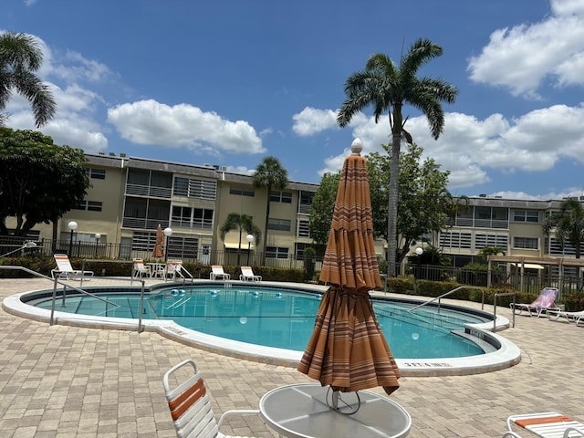 4441 NW 16th St Unit J210, Lauderhill, FL 33313 - community pool featuring a patio area