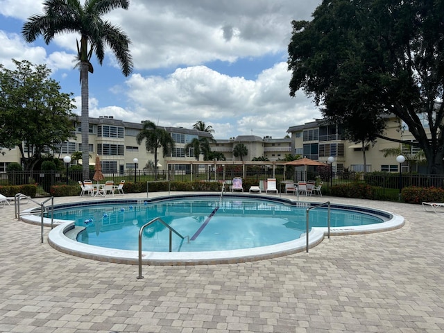 4441 NW 16th St Unit J210, Lauderhill, FL 33313 - community pool featuring a patio