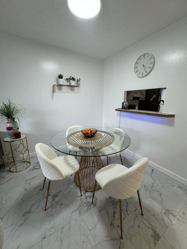 4441 NW 16th St Unit J210, Lauderhill, FL 33313 - dining room with marble finish floors and baseboards