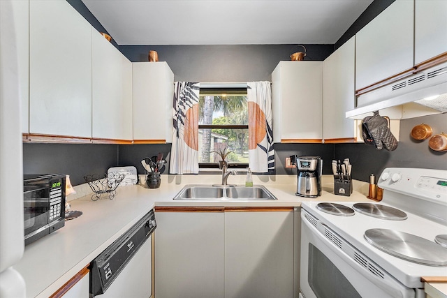 11 Meadows Dr, Boynton Beach, FL 33436 - kitchen with white appliances, a sink, under cabinet range hood, and light countertops