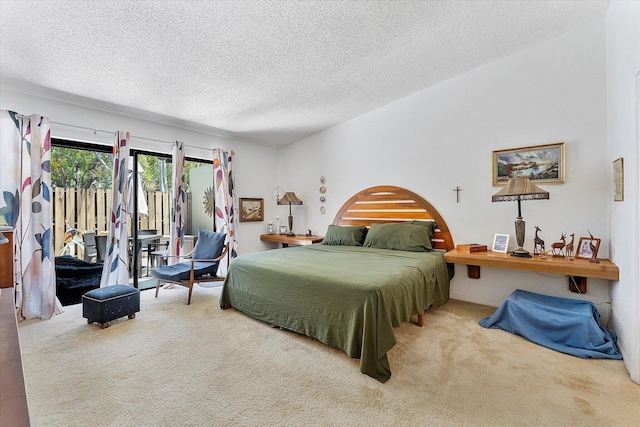 11 Meadows Dr, Boynton Beach, FL 33436 - carpeted bedroom featuring access to exterior and a textured ceiling