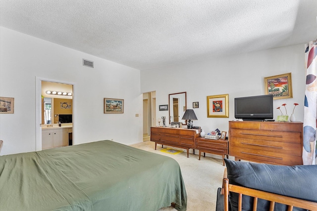 11 Meadows Dr, Boynton Beach, FL 33436 - carpeted bedroom with a textured ceiling and ensuite bathroom