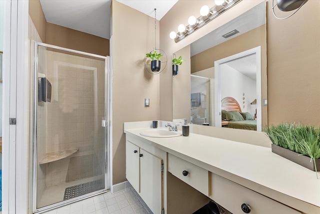 11 Meadows Dr, Boynton Beach, FL 33436 - ensuite bathroom with a stall shower, tile patterned floors, and vanity