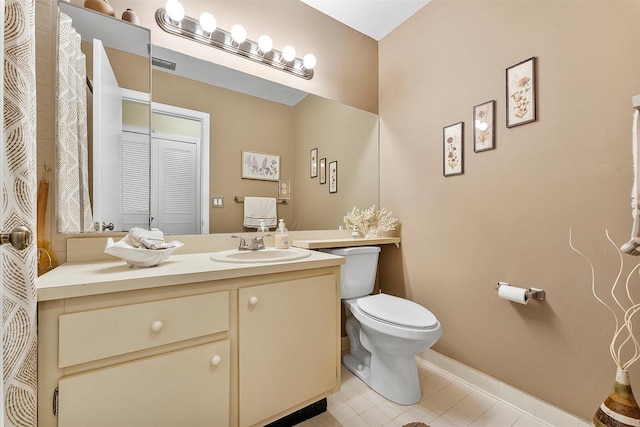 11 Meadows Dr, Boynton Beach, FL 33436 - bathroom with toilet, tile patterned flooring, vanity, and baseboards