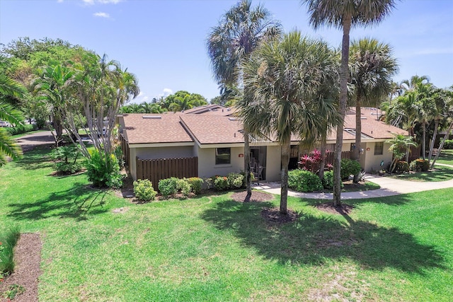 11 Meadows Dr, Boynton Beach, FL 33436 - view of front facade featuring stucco siding and roof with shingles