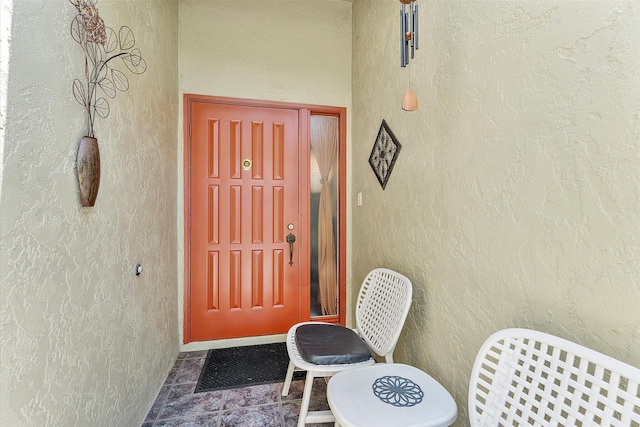 11 Meadows Dr, Boynton Beach, FL 33436 - view of exterior entry featuring stucco siding