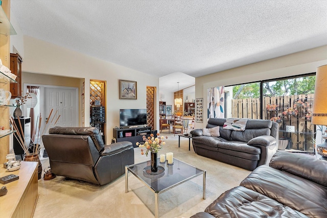 11 Meadows Dr, Boynton Beach, FL 33436 - living area with light colored carpet, vaulted ceiling, and a textured ceiling