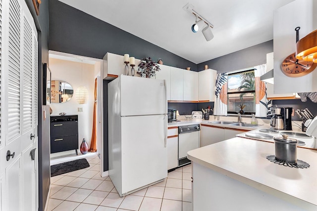 11 Meadows Dr, Boynton Beach, FL 33436 - kitchen featuring white appliances, a sink, rail lighting, light countertops, and light tile patterned floors