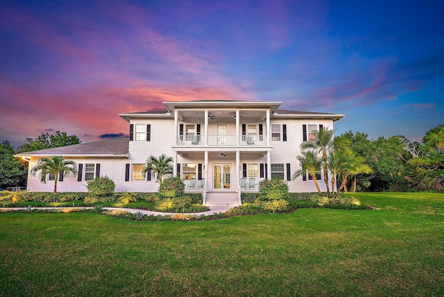 17736 103rd Ter N, Jupiter, FL 33478 - view of front of property featuring ceiling fan, a balcony, french doors, a yard, and covered porch
