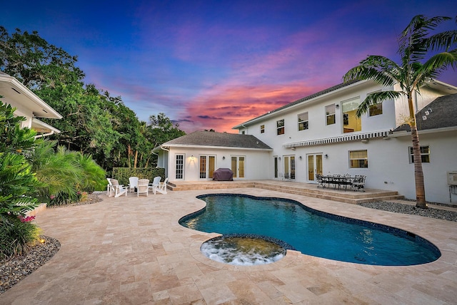 17736 103rd Ter N, Jupiter, FL 33478 - view of swimming pool with french doors, a patio area, and outdoor dining area