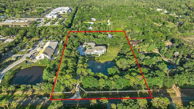 17736 103rd Ter N, Jupiter, FL 33478 - view of property location featuring a heavily wooded area, a large body of water, and property boundaries highlighted