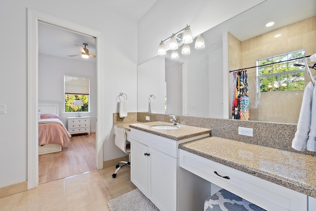17736 103rd Ter N, Jupiter, FL 33478 - ensuite bathroom with healthy amount of natural light, vanity, ceiling fan, and a shower with curtain
