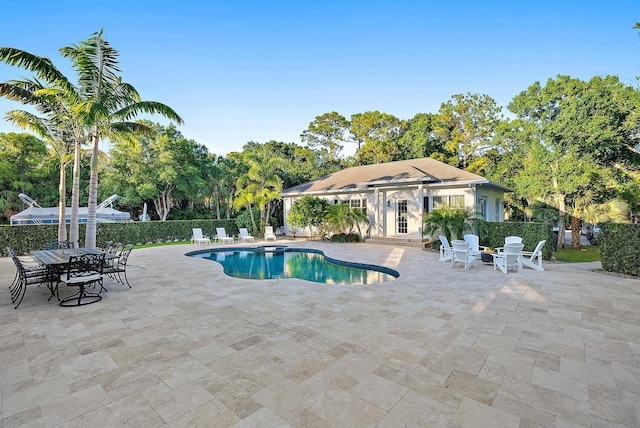 17736 103rd Ter N, Jupiter, FL 33478 - view of pool featuring a patio area and view of scattered trees