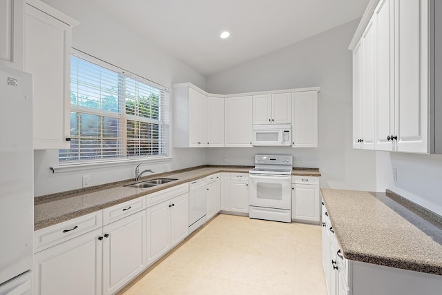 17736 103rd Ter N, Jupiter, FL 33478 - kitchen with white appliances, a sink, lofted ceiling, white cabinets, and recessed lighting