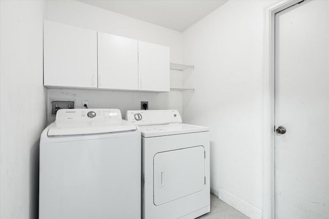 3925 SW Helmlinger St, Port Saint Lucie, FL 34953 - washroom featuring washer and clothes dryer and cabinet space