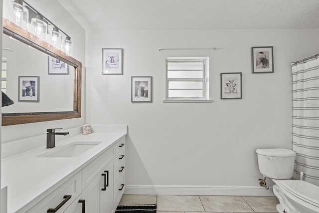 6905 Bayard Rd, Fort Pierce, FL 34951 - bathroom with toilet, vanity, baseboards, a textured ceiling, and tile patterned flooring