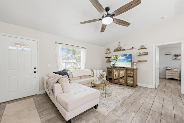 6905 Bayard Rd, Fort Pierce, FL 34951 - living area featuring lofted ceiling, ceiling fan, wood tiled floors, and baseboards