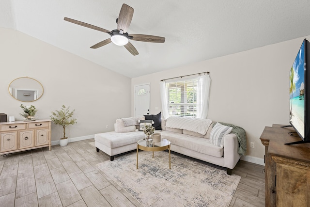 6905 Bayard Rd, Fort Pierce, FL 34951 - living area with lofted ceiling, light wood finished floors, ceiling fan, and baseboards