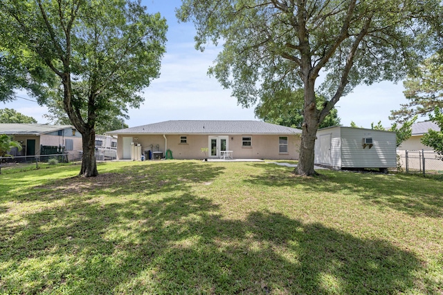 6905 Bayard Rd, Fort Pierce, FL 34951 - rear view of house featuring french doors, stucco siding, and a patio area