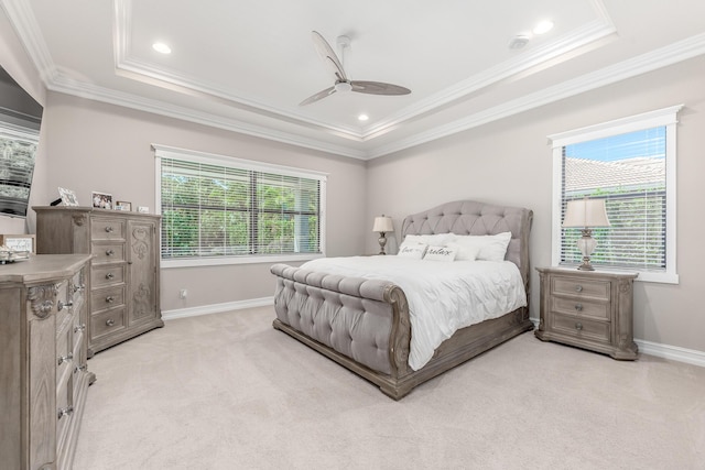 5211 SW Blue Daze Way, Palm City, FL 34990 - bedroom featuring light carpet, a tray ceiling, ornamental molding, ceiling fan, and baseboards