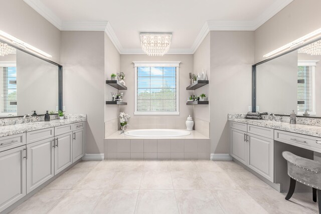 5211 SW Blue Daze Way, Palm City, FL 34990 - bathroom featuring crown molding, two vanities, a garden tub, a chandelier, and baseboards