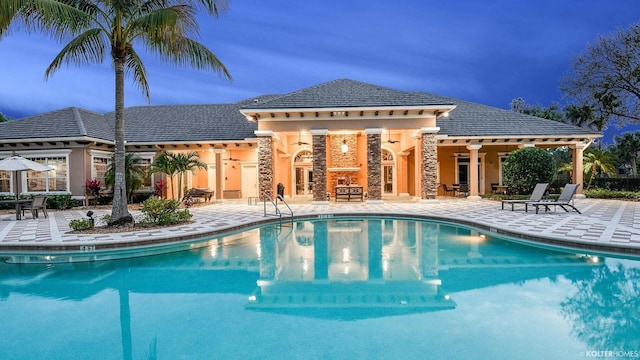 5211 SW Blue Daze Way, Palm City, FL 34990 - community pool with a patio