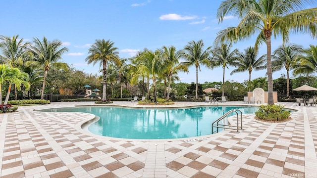 5211 SW Blue Daze Way, Palm City, FL 34990 - community pool with a patio and fence