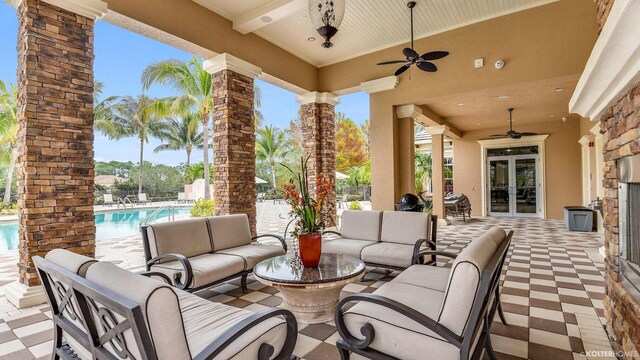 5211 SW Blue Daze Way, Palm City, FL 34990 - view of patio featuring a ceiling fan, an outdoor hangout area, a community pool, and french doors