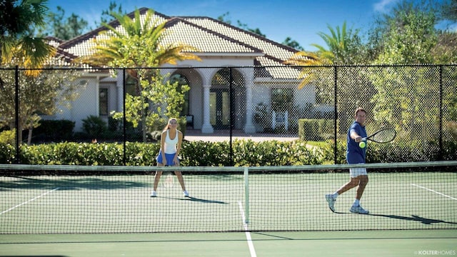 5211 SW Blue Daze Way, Palm City, FL 34990 - view of tennis court featuring fence