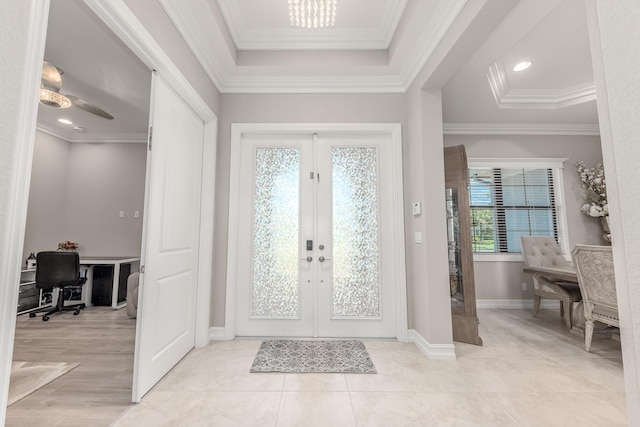 5211 SW Blue Daze Way, Palm City, FL 34990 - entrance foyer featuring french doors, baseboards, crown molding, light tile patterned floors, and a chandelier