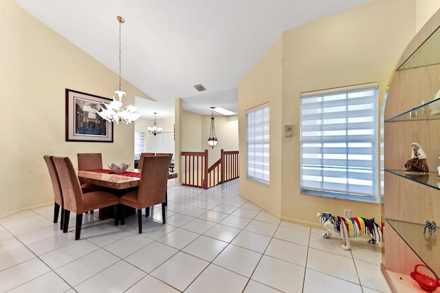 11683 Briarwood Cir Unit 4, Boynton Beach, FL 33437 - dining area with a chandelier, light tile patterned floors, high vaulted ceiling, and baseboards