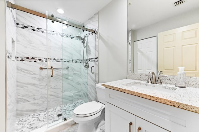 11683 Briarwood Cir Unit 4, Boynton Beach, FL 33437 - full bathroom featuring vanity, toilet, marble finish flooring, a shower stall, and recessed lighting