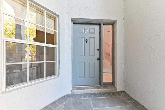 11683 Briarwood Cir Unit 4, Boynton Beach, FL 33437 - entrance to property with stucco siding
