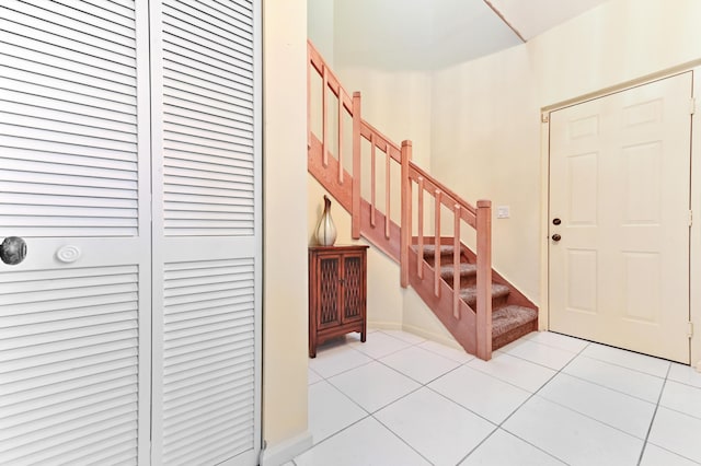 11683 Briarwood Cir Unit 4, Boynton Beach, FL 33437 - entrance foyer featuring light tile patterned flooring and stairs