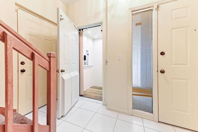 11683 Briarwood Cir Unit 4, Boynton Beach, FL 33437 - hallway with light tile patterned floors and baseboards