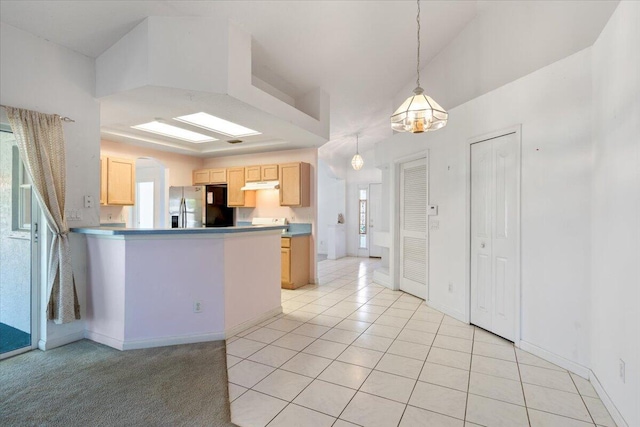 531 SE Evergreen Ter, Port Saint Lucie, FL 34983 - kitchen featuring stainless steel refrigerator with ice dispenser, under cabinet range hood, light brown cabinets, a peninsula, and light tile patterned floors