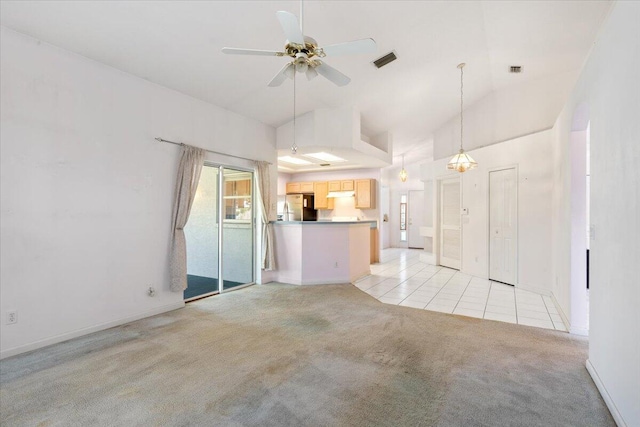 531 SE Evergreen Ter, Port Saint Lucie, FL 34983 - unfurnished living room with light colored carpet, lofted ceiling, light tile patterned floors, a ceiling fan, and baseboards