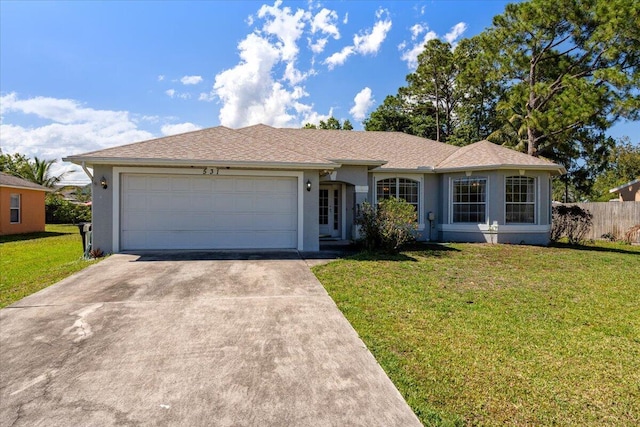 531 SE Evergreen Ter, Port Saint Lucie, FL 34983 - single story home with concrete driveway, stucco siding, and an attached garage