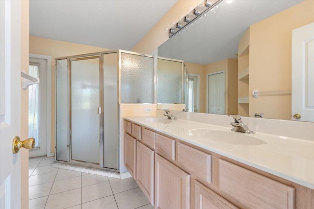 531 SE Evergreen Ter, Port Saint Lucie, FL 34983 - full bathroom with tile patterned floors, a stall shower, and double vanity