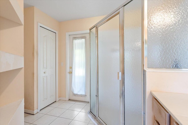 531 SE Evergreen Ter, Port Saint Lucie, FL 34983 - bathroom with a shower stall, tile patterned floors, and vanity
