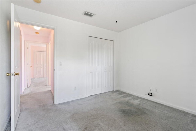 531 SE Evergreen Ter, Port Saint Lucie, FL 34983 - unfurnished bedroom with carpet, baseboards, and a closet