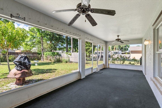 531 SE Evergreen Ter, Port Saint Lucie, FL 34983 - unfurnished sunroom featuring ceiling fan and plenty of natural light