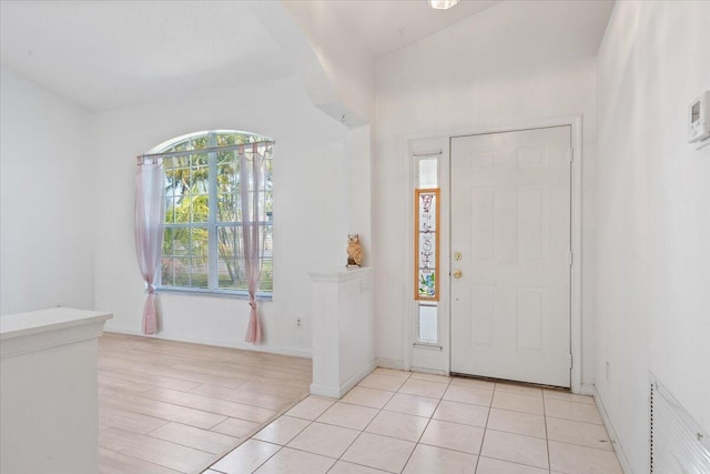 531 SE Evergreen Ter, Port Saint Lucie, FL 34983 - foyer entrance featuring light wood finished floors and baseboards