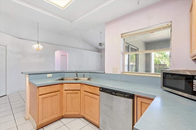 531 SE Evergreen Ter, Port Saint Lucie, FL 34983 - kitchen with stainless steel appliances, a sink, arched walkways, a ceiling fan, and light countertops