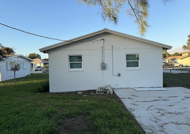 view of side of property featuring a patio