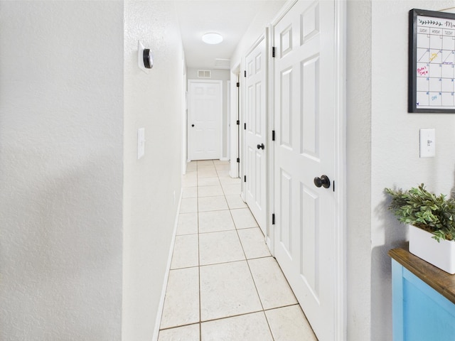 3307 SW 22nd St, Okeechobee, FL 34974 - hallway with light tile patterned floors and a textured wall