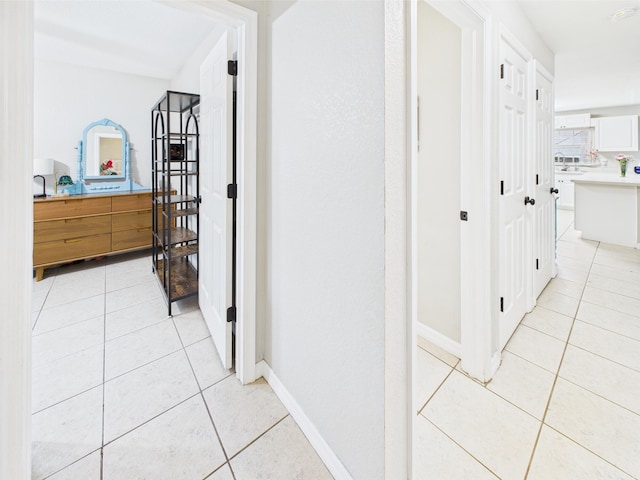 3307 SW 22nd St, Okeechobee, FL 34974 - corridor featuring light tile patterned floors and baseboards